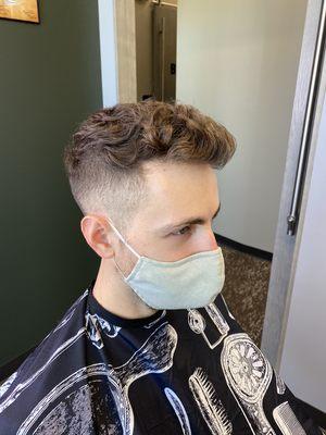 Fade haircut with disconnected top