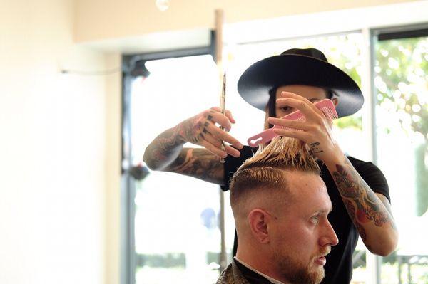 High skin fade and hard part in action by @popethebarber