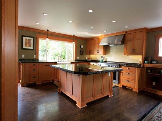 New Mission/Craftsman inspired cabinetry in Vertical Grain Fir with Quartz countertops.