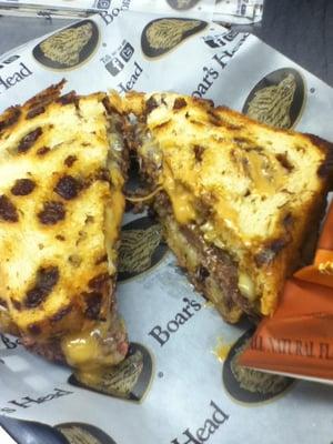 Cow Patty! It's a Patty Melt on grilled raisin bread and creamy peanut butter. Grilled to perfection.