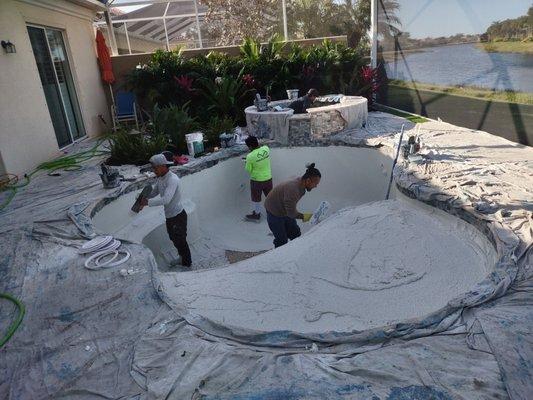 Plaster being installed on new pool.