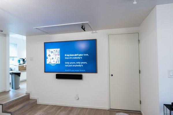 Installation of flat screen tv with panel to hide cords, installation of new door by North Seattle Handyman