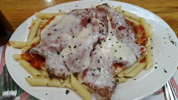 Chicken parmesan on penne pasta