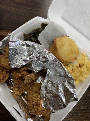 Chicken wings, Mac & cheese, greens, and corn bread.