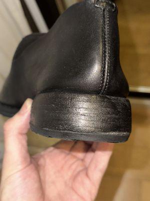 The stacked leather soles that Vince's buffed and painted despite not requesting it.