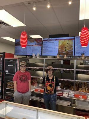 Sarah and Jennifer full of smiles and serving up Donuts in Lubbock!