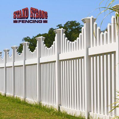 White fence with decorative posts and pickets.