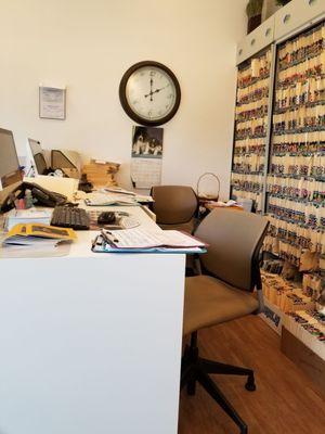 The receptionist desk area was cluttered and filthy.