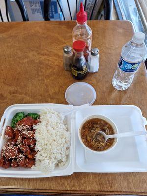 Sesame chicken, steamed rice, and spicy soup - lunch portions.