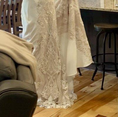 Day of my wedding. No change in lace pattern and way too long.