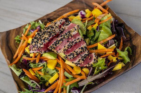 Ahi Tuna Salad- just one of our delicious polynesian inspired dishes. Be sure to pair it with a fruity cocktail!