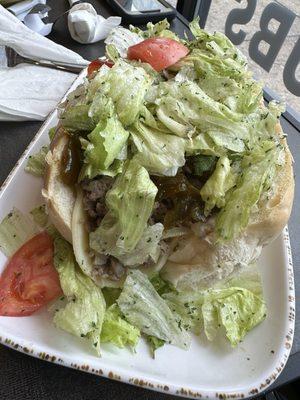 Cheesesteak with seasoned lettuce and sweet peppers! A local fav.