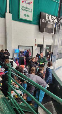 mob of kids changing skates to sneakers.