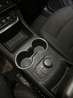 Missing a rubber piece for the cup holders.