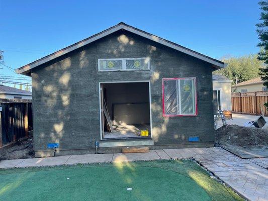 Stucco to match the rest of the existing house.