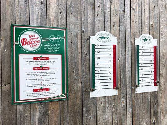 Rules and scoreboards next to the bocce court