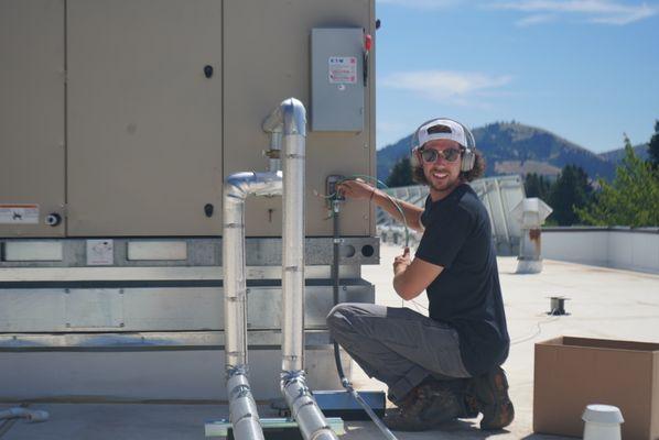 Our happy team member installing Our Radon mitigation systems into a new school! Safety for all!