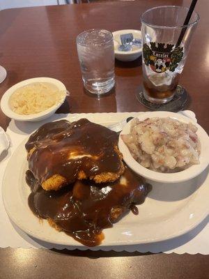 Alpine Schnitzel King size with German potato salad and sauerkraut