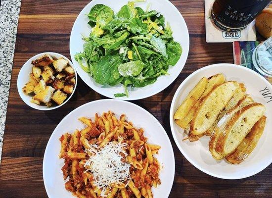 House pasta with homemade garlic bread and salad