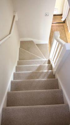 Carpeted staircase.