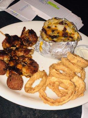 BBQ shrimp wrapped in bacon , onion rings , loaded baked potato