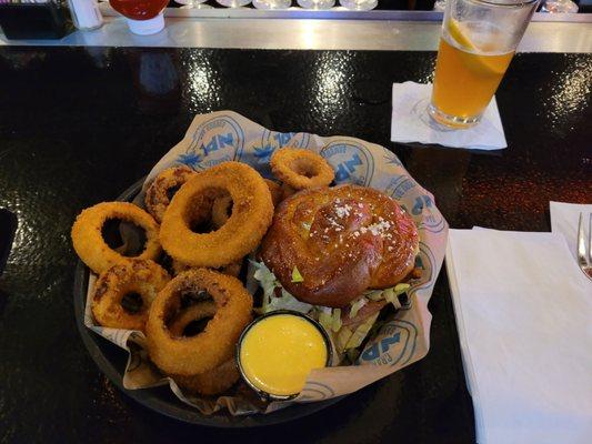 Turkey Melt on pretzel bun with onion rings