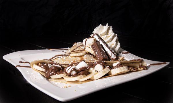 S'mores in a crepe format. Nutella, Banana, Marshmellows, Kitkat, Graham Cracker. Yummm!!