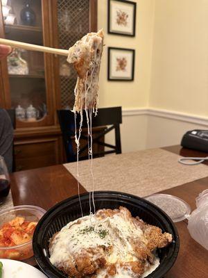 Pork donkatsu showing the stringy cheese.