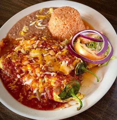 Chiles Rellenos, stuffed Anaheim chilies stuffed with cheese blend served with rice, beans and tortillas