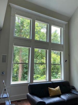 A huge wall of windows. He climbed way up and removed paint and silicone that had been there for years.