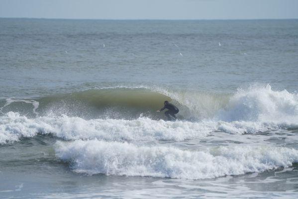 Frank the owner surfing Bob Hall Pier