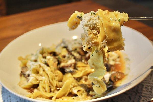 The Roasted Wild Mushroom Pappardelle is made with black truffle vinaigrette, vegan parmesan, roasted garlic and mountain herb migas.