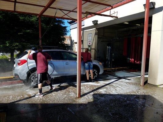 Scrubbing cars before they go through the tunnel.