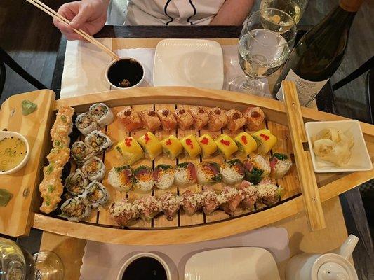 Sushi boat with various rolls.