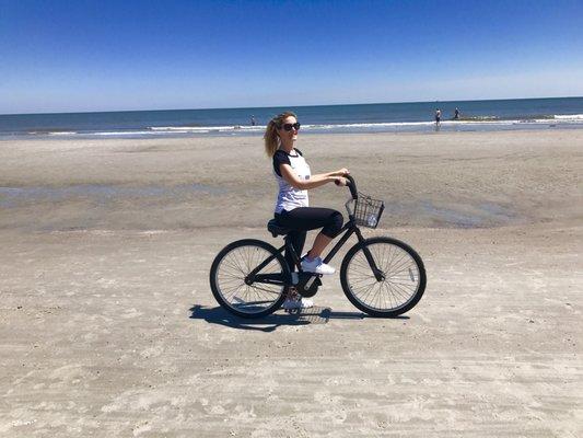 Riding a pedals bike on the beach