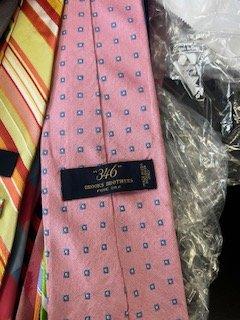 This ties  was ironed by hand leaving it shiny and manny creases showing the inside guts of the tie through the front, totally ruined