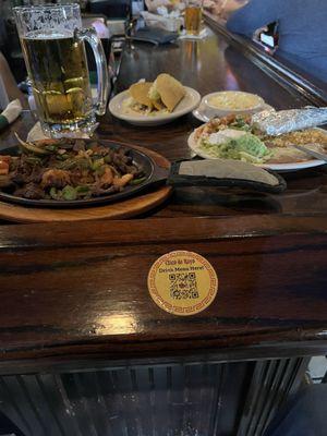 Lunch portion of fajitas. Very good value and quantity. Added a couple hard shell beef tacos.