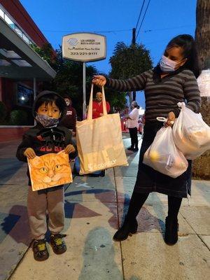 Mini book libraries were distributed to children during Covid19 along with groceries for families!