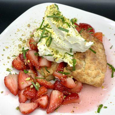 Strawberry Shortcake - Butter biscuits from scratch, macerated strawberries, fresh mint, crushed pistachio, fresh whipped sweet cream