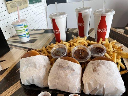 Left to right, chicken sandwich, 2 burgers, a ton of fries, strawberry shake