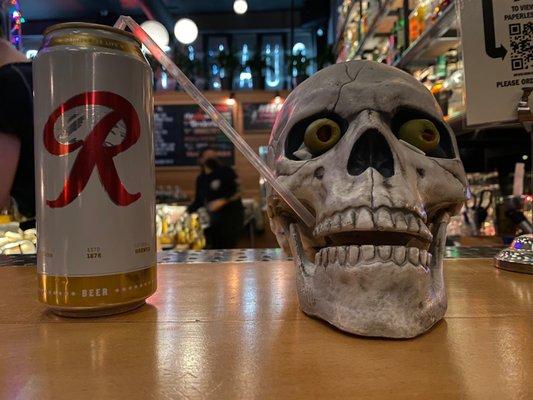 Ice cold tall cans of Rainier: $3. A skull with olives in his eye sockets to keep you company: free of charge.