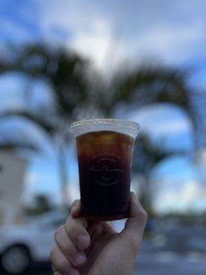 Iced Americano. Cups with their logo