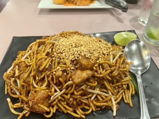 Spicy Indian pan fried egg noodle dish with chicken. Very good if you like spicy! More of a spicy/sour flavor.