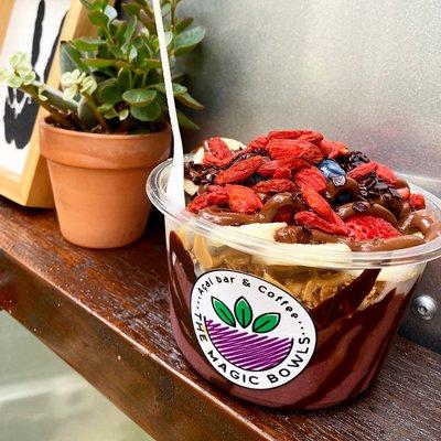 Açai Bowl with chocolate drizzle, granola, fresh fruit, gogi berries, and nutella