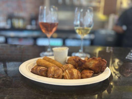 Gametime snacks with a glass of rosé and a glass of Chardonnay