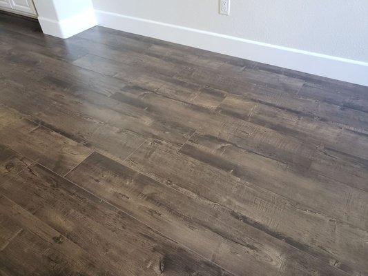 Eternity Floors, Pecan, 12mm water resistant laminate AC5 w/ pad attached.