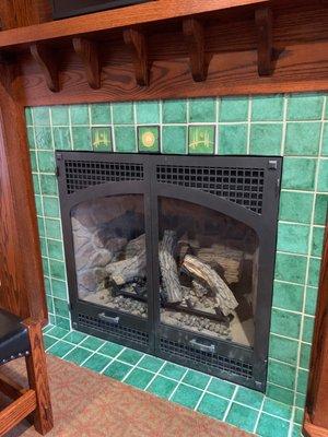 Cute gas fireplace in the room.