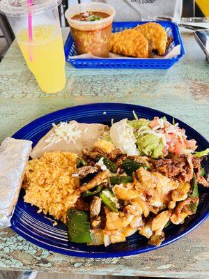 Picture of the Alambre Supreme ($16.99) and BIRRIA RAMEN & 2 QUESABIRRIAS ($12.99), with the Pineapple Agua Fresca drink