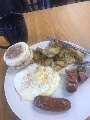 Eggs over medium hard with lol sausage and potatoes