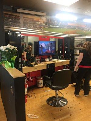 Tv's mounted on each stylist station. Super nice touch! This should keep my 12 year old son from moving while getting his hair cut!